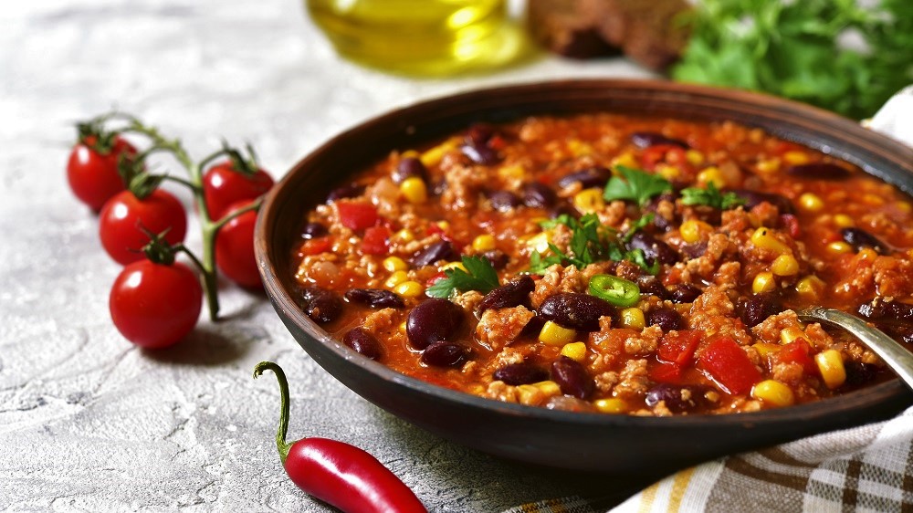 Chili con carne - traditional dish of mexican cuisine. • Koch-Mit