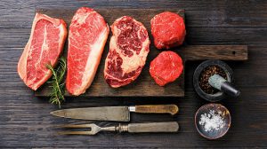 airfryer steak Variety of Raw Black Angus Prime meat steaks Blade on bone, Striploin, Rib eye, Tenderloin fillet mignon on wooden board